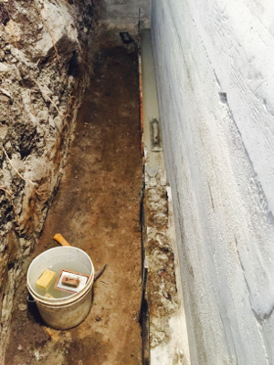 Defective foundation footer voids filled with rapid set cement