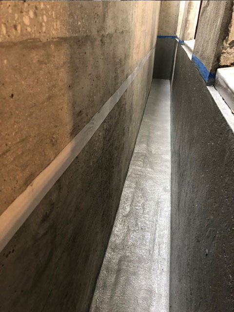 Foundation cement resurfacing under windows and floor
