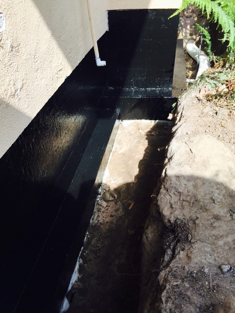 Foundation waterproofing applied after repairs