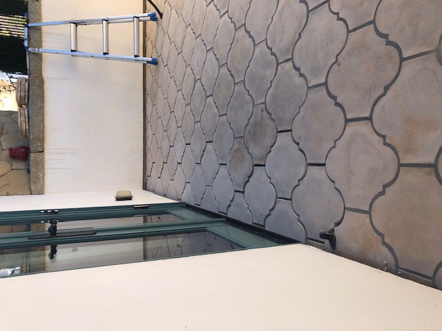 New deck tiles installed to waterproofing correction area