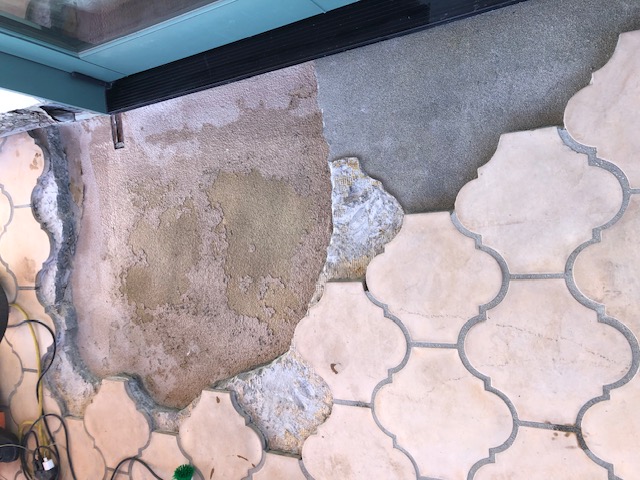 Deck overview, delaminating membrane over plywood substrate, sloping mortar bed, secondary waterproofing over mortar bed, deck tile installed over mortar bed