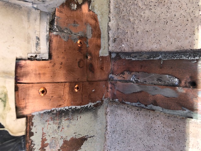 Copper rivets installed to deck copper flashings connections