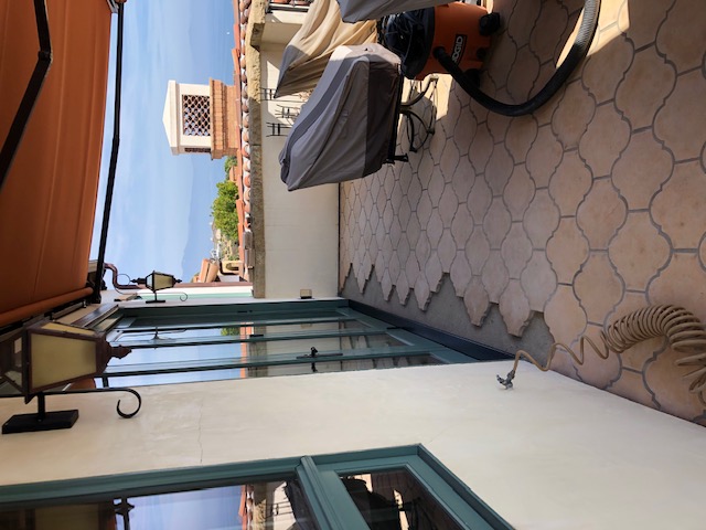 Defective deck flashing under door threshold creating interior leaks