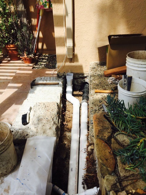 Basement french drain extending through foundation
