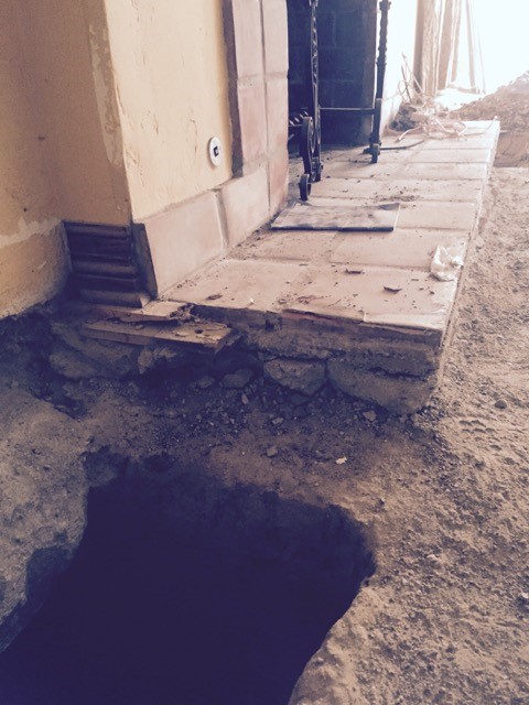 Concrete underpinning basement chimney footings