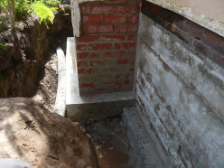 Foundation footing repairs prior to waterproofing