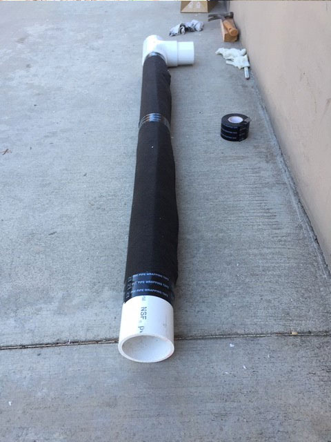 Sections of planter wall french drain with filter fabric installed