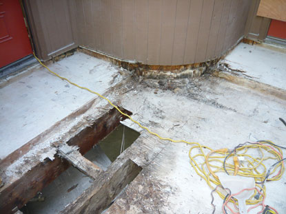 Elevated deck structural dry rot and termite damage to load bearing beam.