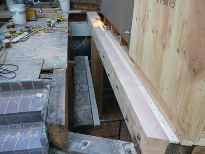 Structural dry rot to courtyard deck load bearing structural beam requires bolting sister beam