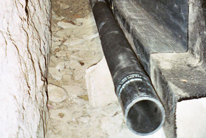 Orange County foundation waterproofing -FPerforated drainage pipe wrapped with geotechnical filter fabric