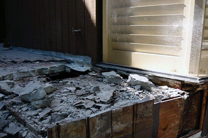 Defective courtyard deck waterproofing creating termite damage