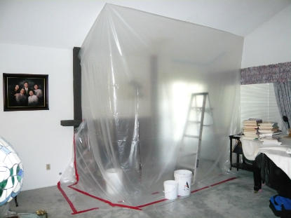 Fireplace containment barriers are constructed to isolate water damage and spread of mold spores