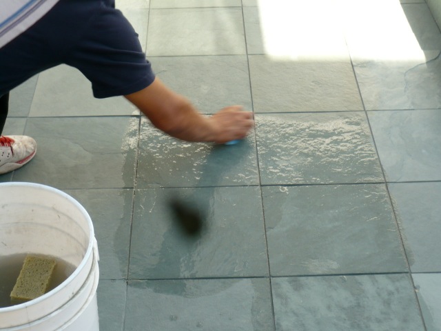Slate tile installation over deck waterproofing located above condominium subterranean garage