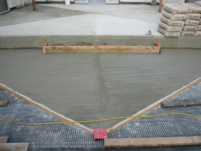 Structural deck sloping eliminates ponding of surface water