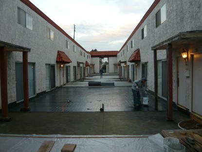 Sheet applied membrane is applied to vertical perimeter deck flashing