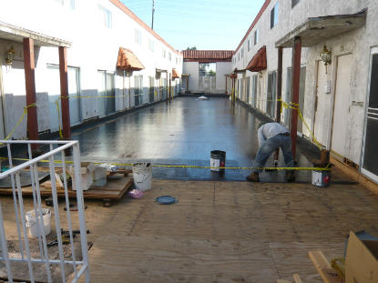 Application of two coats CCW 525 waterproofing to structural plywood
