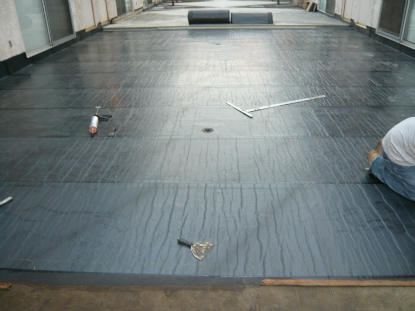 Sheet applied membrane creating a monolithic waterproofing system