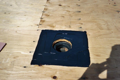 Prior to installing new deck drain, urethane applied for waterproofing seal